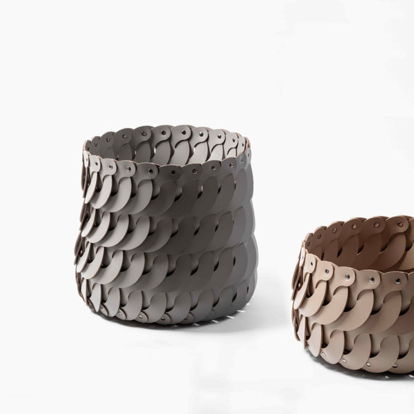 Styled Alicante Tall Round Basket by Pinetti, crafted in regenerated leather with a sculptural interlocking design. Elegant, functional storage in Antibes leather colours.