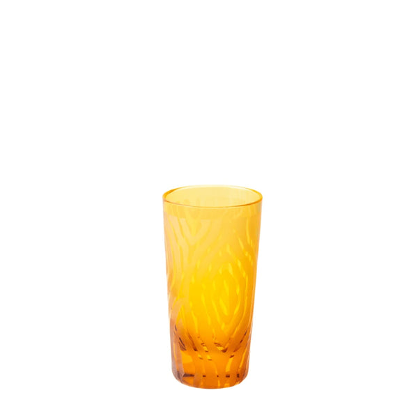 An elegant amber-colored vodka shot glass with a woodland design, part of the 'Alice Collection' by Cristallerie de Montbronn.