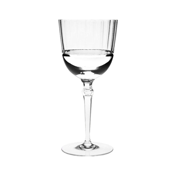Alya red wine glass in crystal with sleek vertical cuts by Cristallerie de Montbronn. on a white background