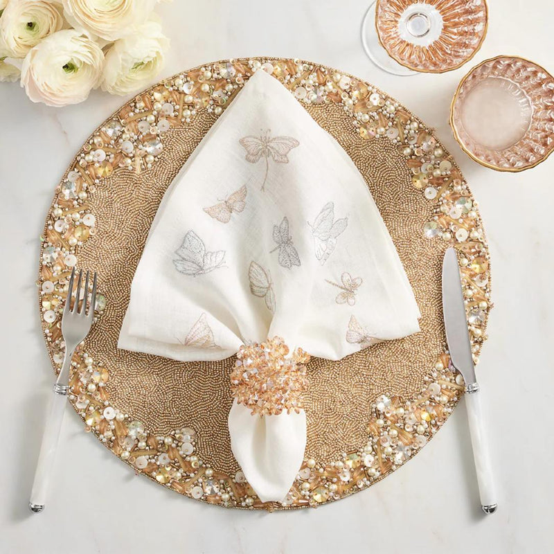 Hand-beaded Aster napkin ring in champagne by Kim Seybert for elegant table decor.