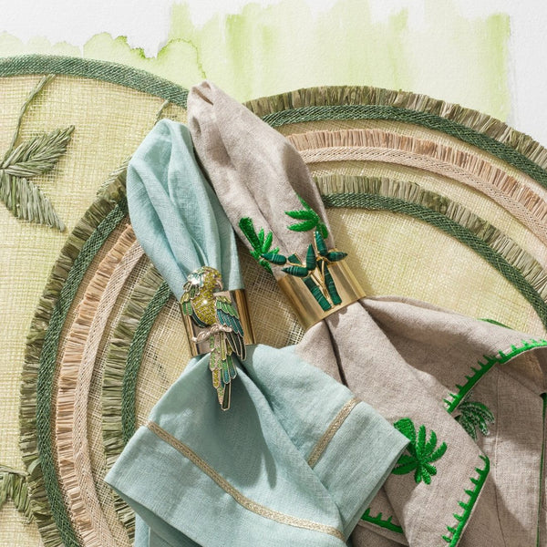 Bamboo napkin ring by Joanna Buchanan styled on rattan placemat.