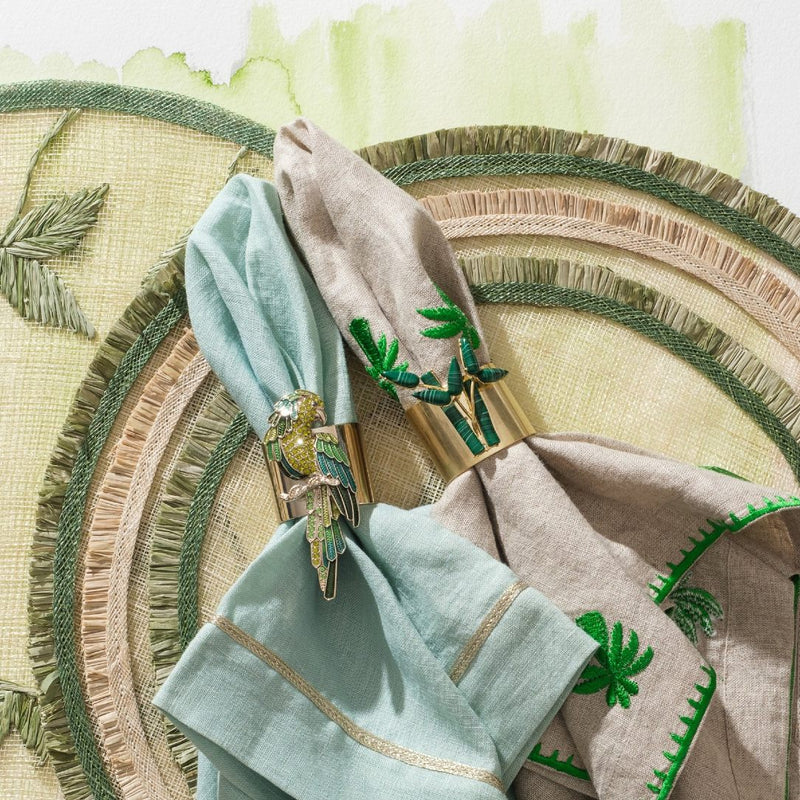 Bamboo napkin ring by Joanna Buchanan styled on rattan placemat.