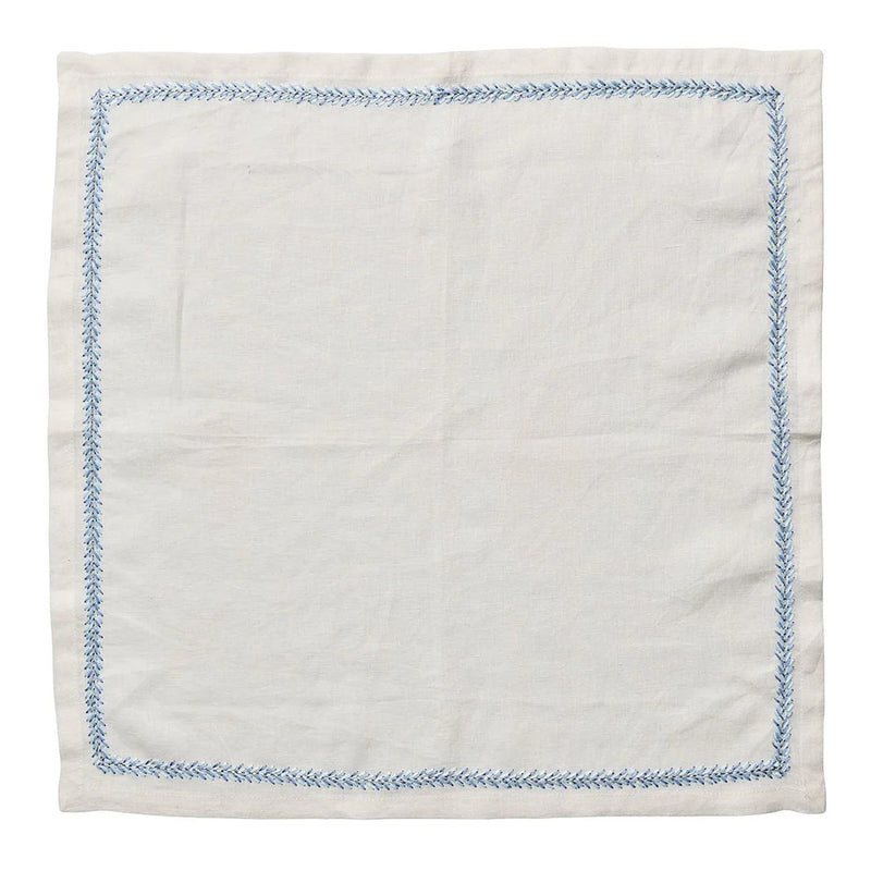 Unwrapped white linen Jardin napkin with periwinkle border on white background by Amiramour