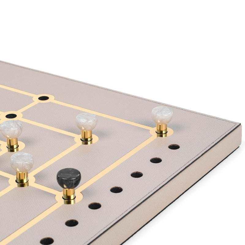 Close-up of Mill Game Set in Cream Grained Leather with gold detailing and eco-shell pawns by Pinetti