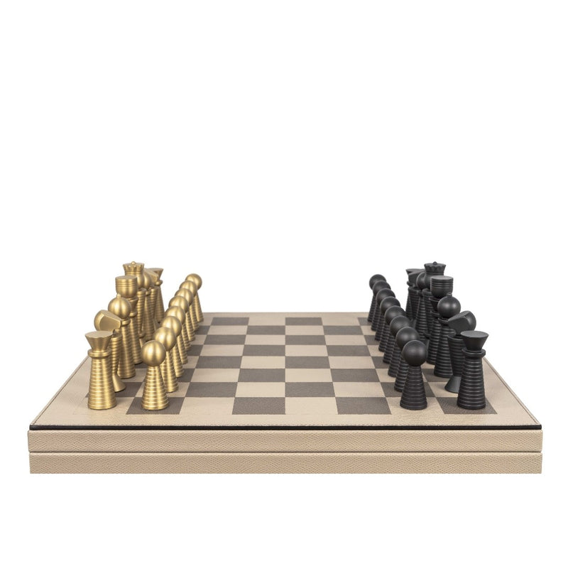 Chess set with gold and black pieces on a checkered board