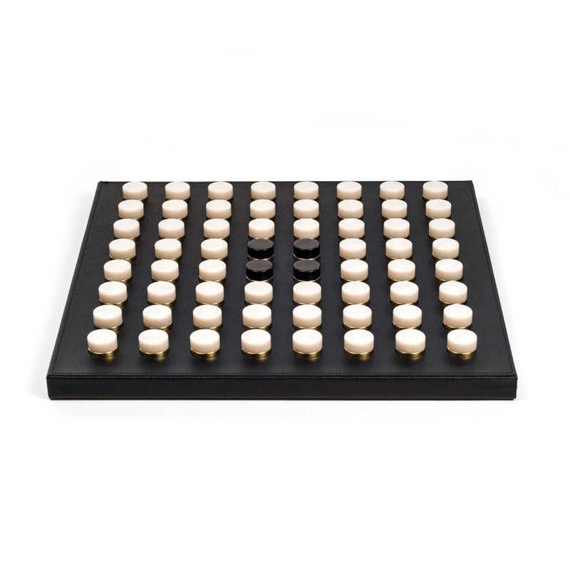 Side view of the Luxury Reversi game board by Pinetti in black leather featuring eco-shell and gold pawns, elegant strategy game on Amiramour.