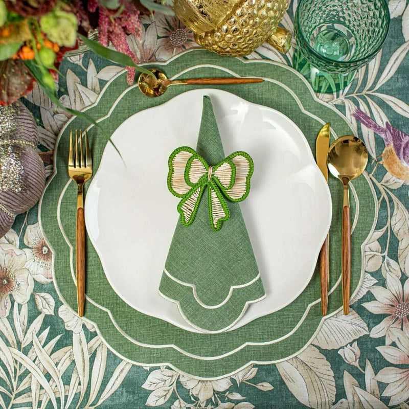 Green and beige bow napkin rings by Roseberry Home styled with green napkin.