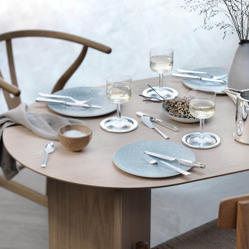 Cutlery set 36 pieces Art Deco silver-plated placed on dining table.