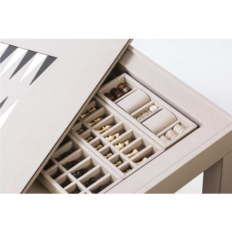 Detail of the Venezia Game Table by Giobagnara revealing concealed trays with chess and backgammon pieces in leather compartments.