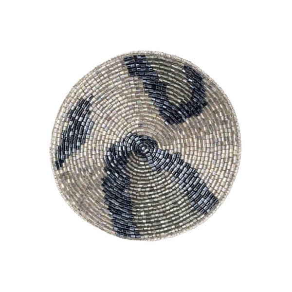 Round beaded coaster with blue and silver pattern on a white background