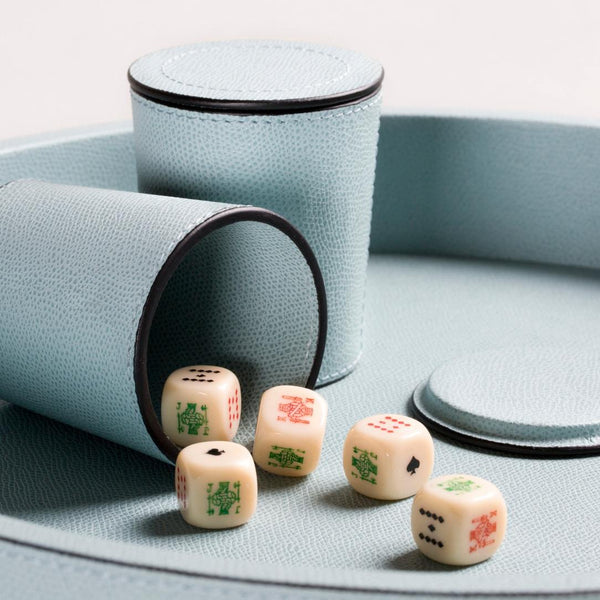 Close-up of Arena Monochrome Dice Set in blue Golf leather showing cups and dice by Giobagnara.