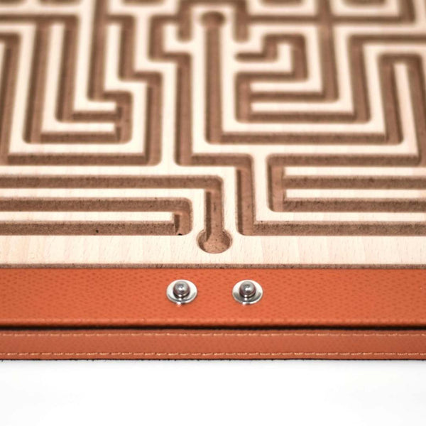 Close-up of Luxury Arianna Square Labyrinth in orange grained leather with wooden maze by Pinetti
