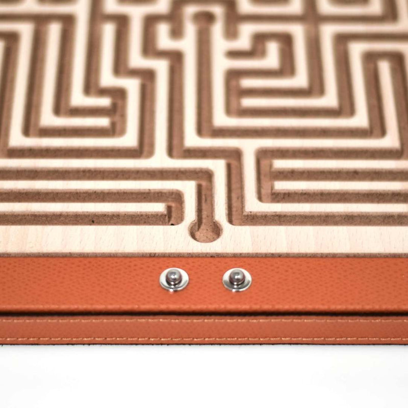 Close-up of Luxury Arianna Square Labyrinth in orange grained leather with wooden maze by Pinetti