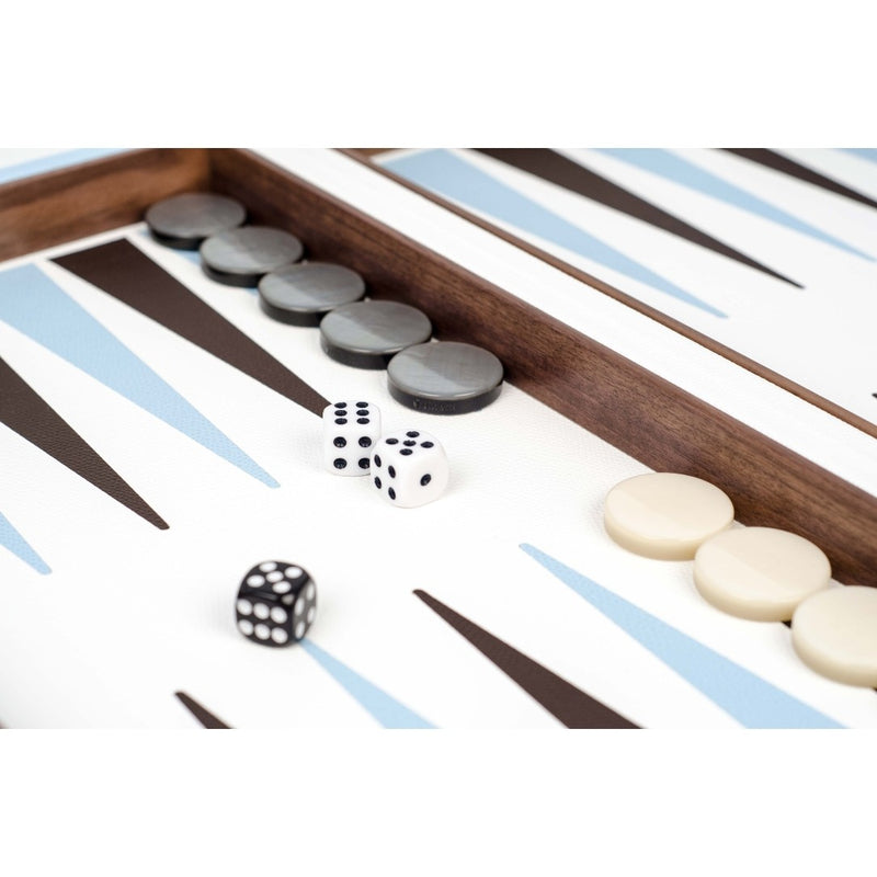 Close-up of Pinetti backgammon set in Arctic Blue grained leather showing luxury leather inlay and polished playing pieces.