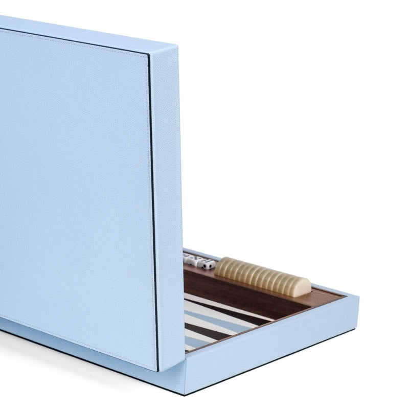 Side view of Pinetti backgammon game set in Arctic Blue grained calfskin leather with elegant wooden edge detailing.