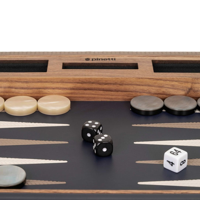 Backgammon board with dice and pieces, featuring the brand 'Pinetti'.