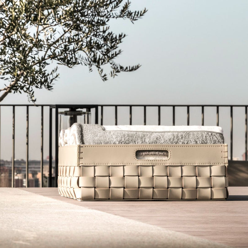 Barcellona outdoor leather yacht shoe and towel basket by Giobagnara x Riviere on a wooden deck