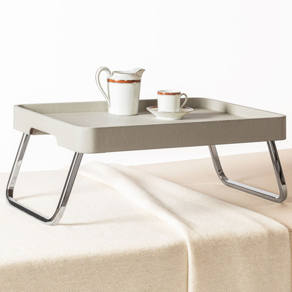 Bed Leather Folding Tray in Pelle Frau® by Giobagnara x Poltrona Frau with a pitcher and cup on a white background