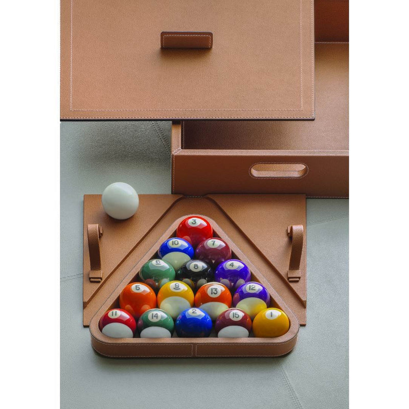 Set of billiard balls in a wooden triangle rack with a white ball on a light gray surface.
