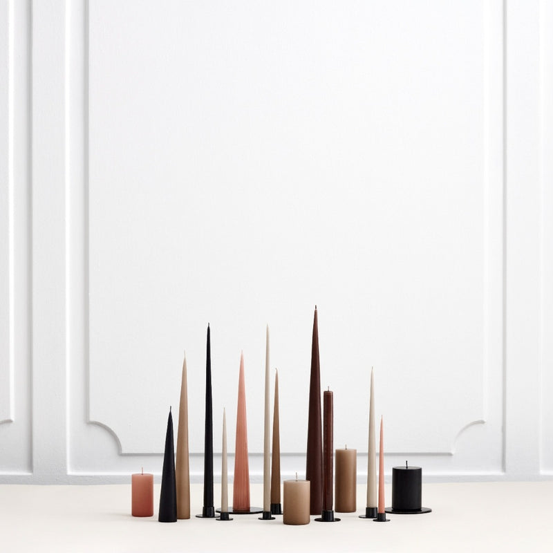 styled group of taper and pillar candles with the black pillar candle by Ester & Erik