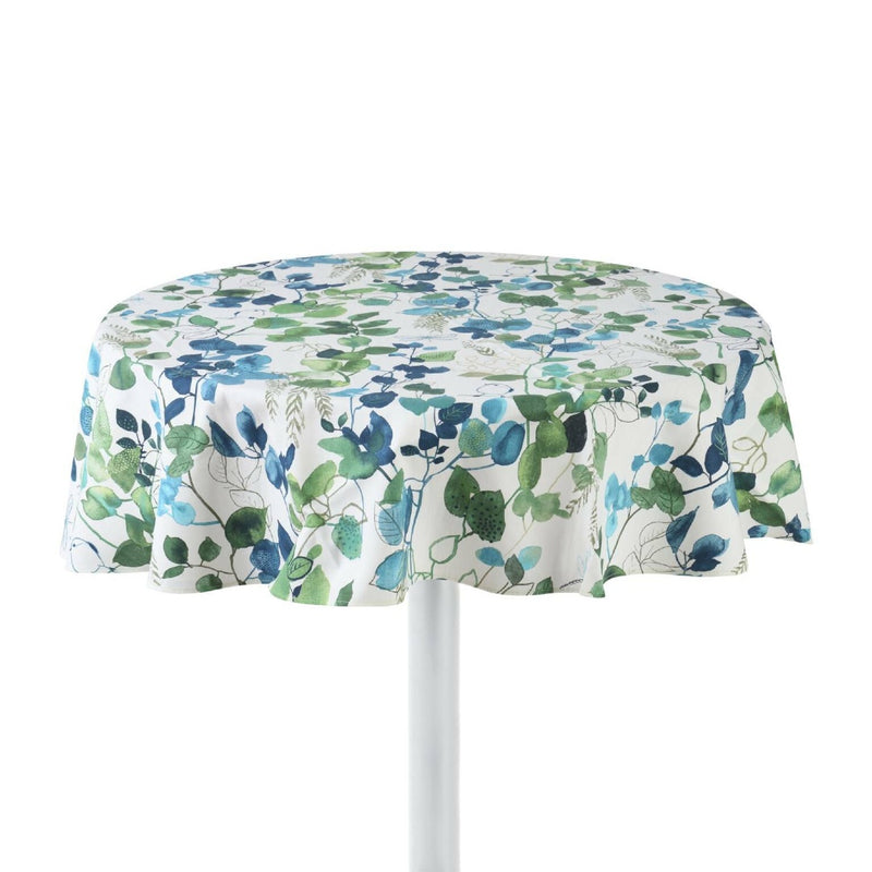Round cotton tablecloth with a floral pattern in beige, blue, and green colors, featuring a sparrow motif, displayed on a table with a white base.