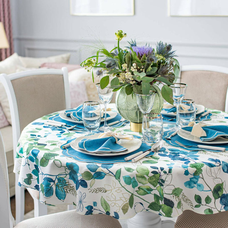 Blue Sparrow round cotton tablecloth with blue bird print by Roseberry Home styled  in a light dining room