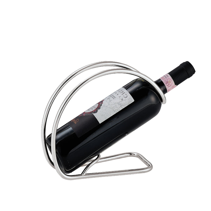 A silver plated bottle holder by Greggio, designed to hold a bottle elegantly, with a focus on the sleek, curved metallic structure.