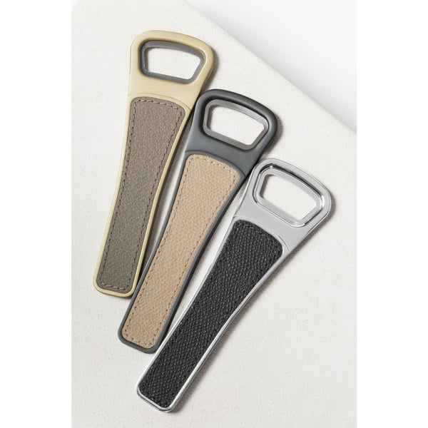 Three Brooklyn long bottle openers with textured handles by Giobagnara on a light gray background 