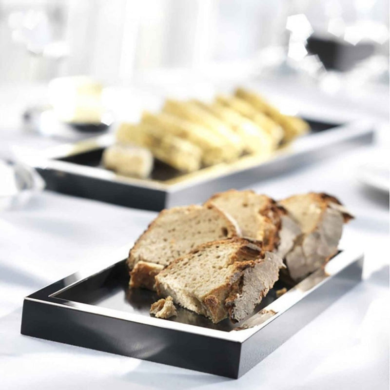 Sliced bread on a silver-plated bread tray with black base by Robbe & Berking