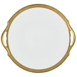 A white porcelain cake dish with a gold Renaissance style border, inlaid with gold details, and a handle on the side.