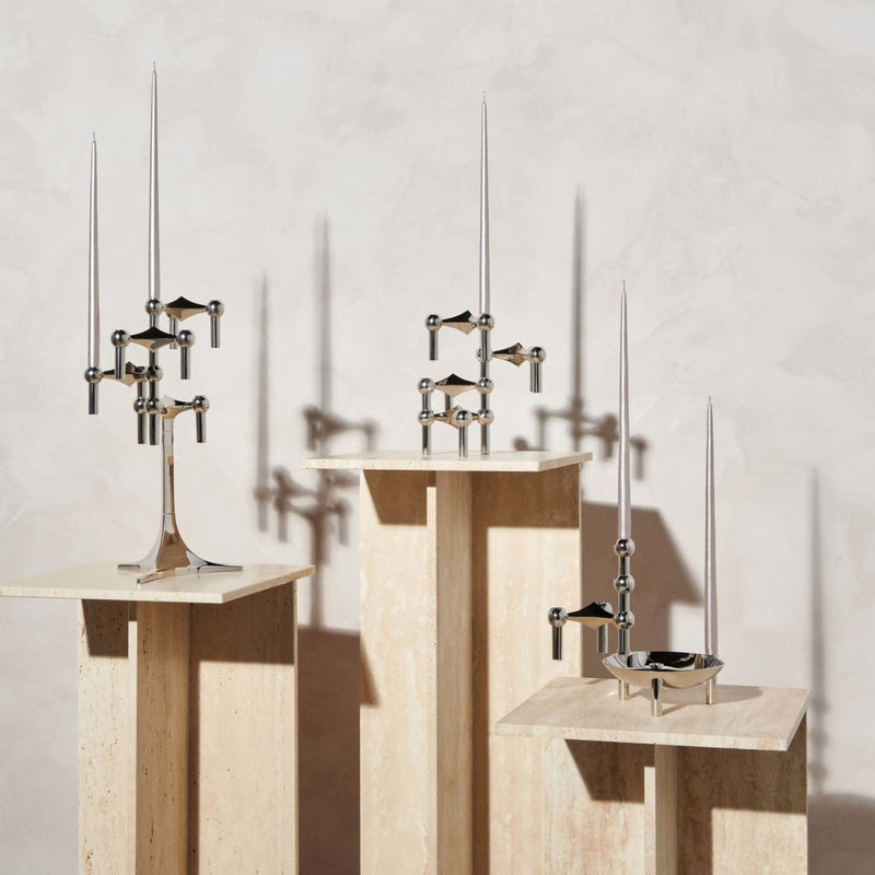 Modern bathroom fixtures including a sink and faucets on a neutral background