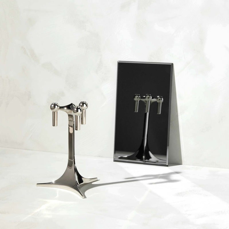 Metallic stand with a rectangular mirror on a white background