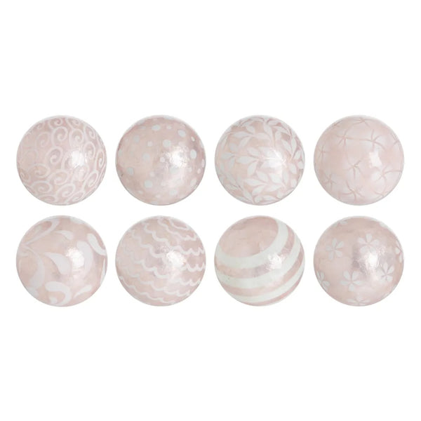 A set of round capiz shell decorative balls in pink with unique patterns, displayed on a plain background.