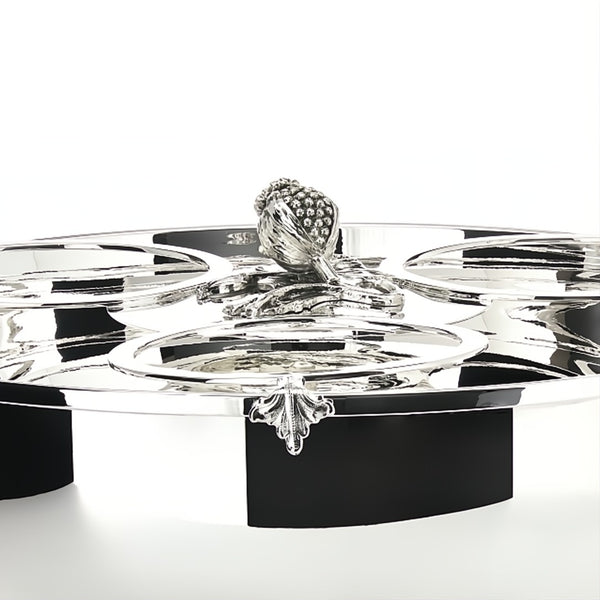 Close-up Silver-plated champagne cooler for three bottles by Schiavon, featuring ornate handles and lid