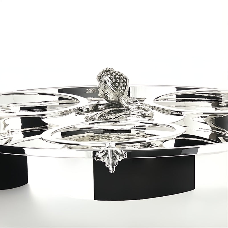 Close-up Silver-plated champagne cooler for three bottles by Schiavon, featuring ornate handles and lid