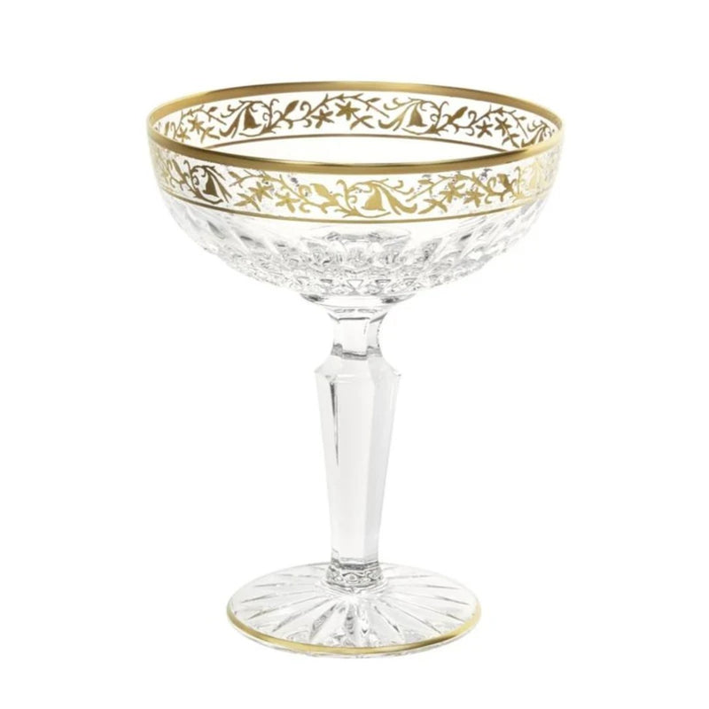 Viktoria crystal champagne coupe with diamond cuts and gold inlay by Cristallerie de Montbronn on a white background