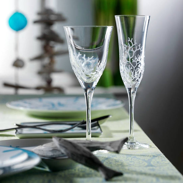Styled table with Hand-engraved champagne glass with coral reef design by Varga Crystal