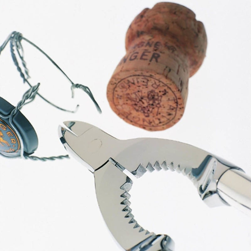 Champagne tongs Dante silver-plated by Robbe & Berking, cork, and glasses on a white background