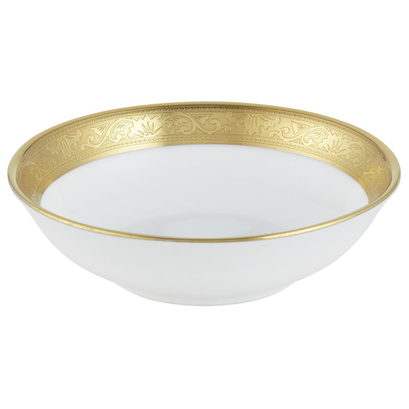 A white porcelain cup with a gold inlaid border and floral details, featuring a luxurious gold rim.