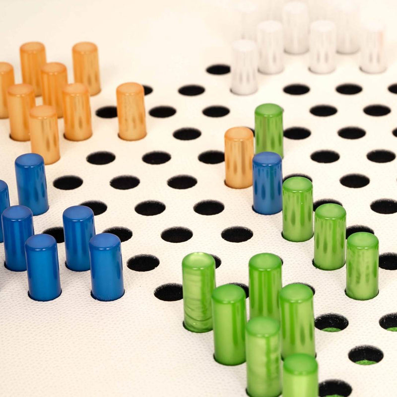 Colorful cylindrical game pieces on a Chinese Checkers Game Set on grained leather board by Pinetti