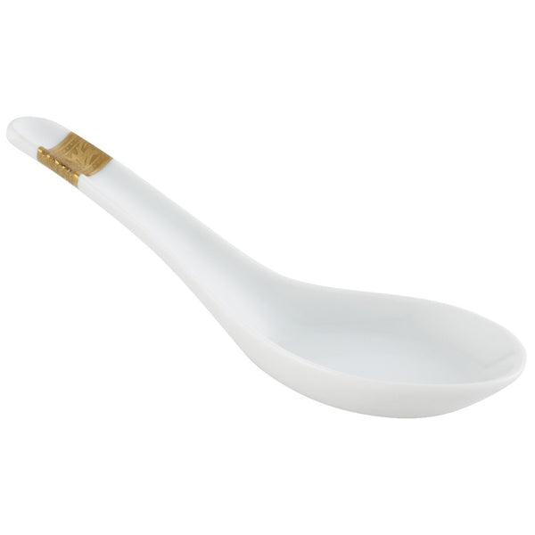 A white porcelain spoon with gold inlay decorations on the edges, featuring a rounded bowl and a curved handle with a gold band at the junction.