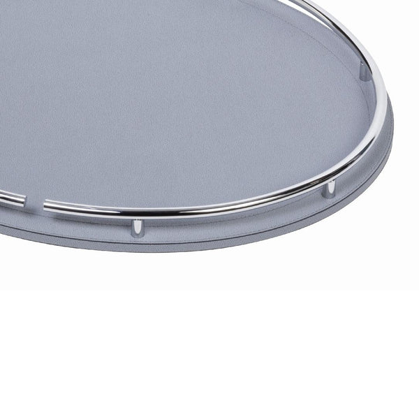 Close-up of the Circus oval leather tray by Giobagnara, handcrafted in Italy with chrome metal handles and leather-covered wood base.