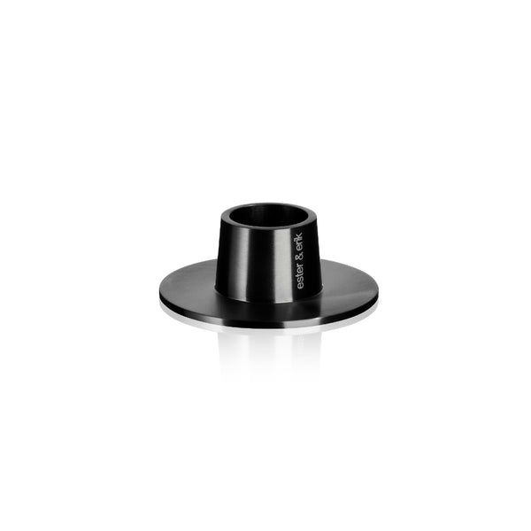 A single black matte classic candle holder with a visible brand marking on the top.