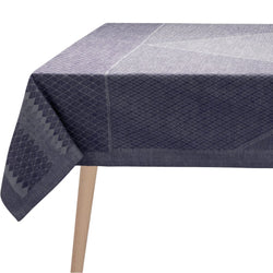 Navy blue geometric patterned tablecloth on a wooden table.