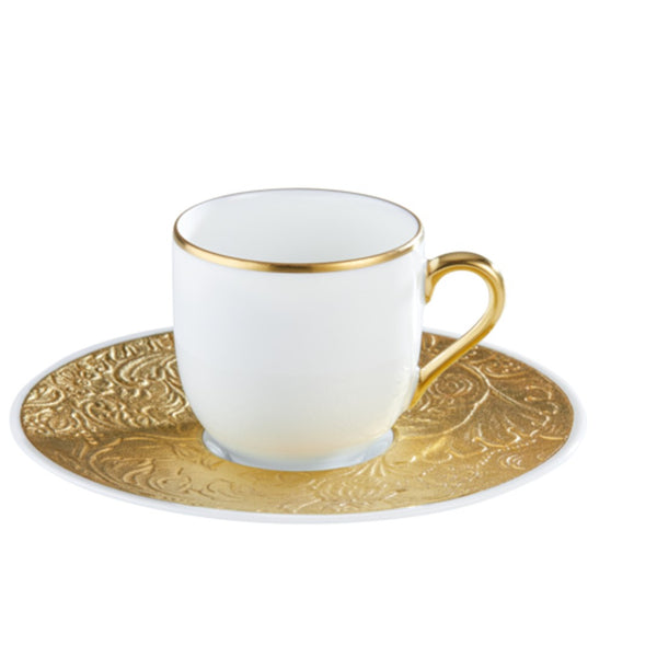 Porcelain coffee cup with gold rim and handle, paired with a richly decorated gold saucer from the Italian Renaissance Gold collection by Raynaud.