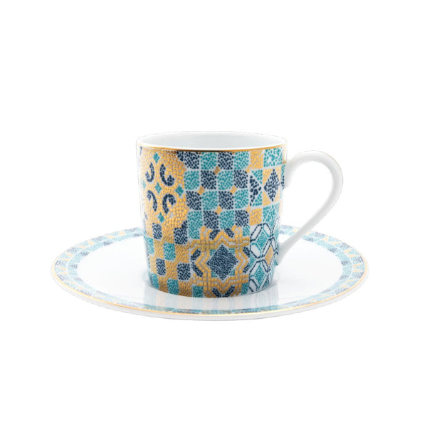 Patterned cup and saucer on a white background