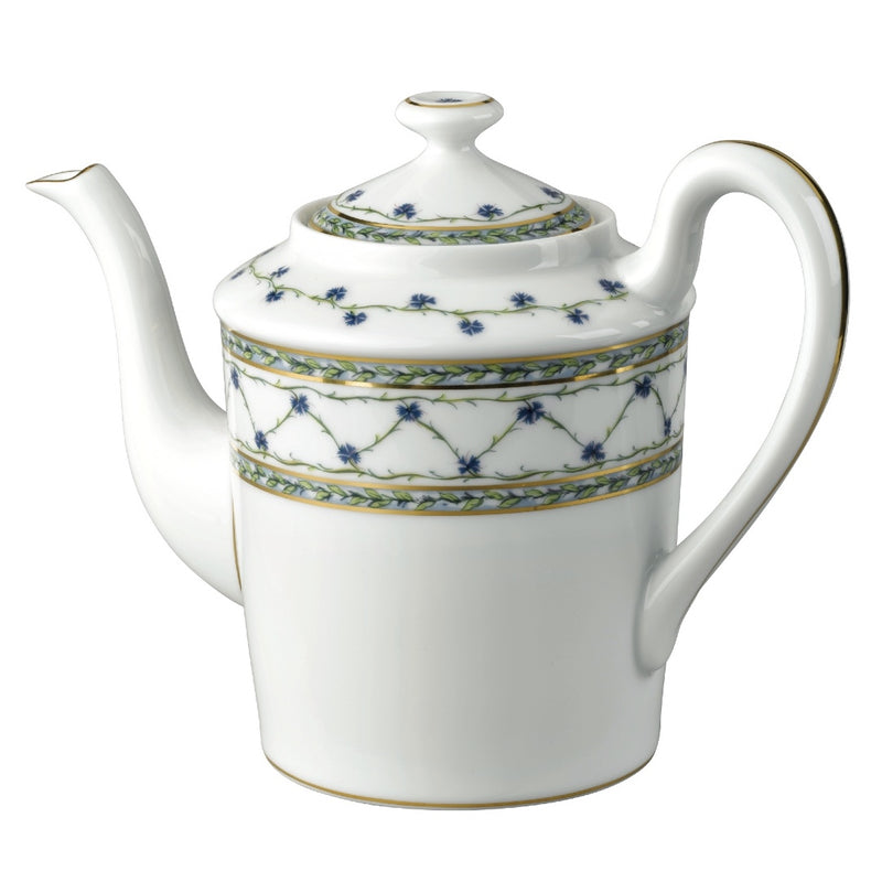 A white porcelain coffee pot with blue floral patterns and gold accents.