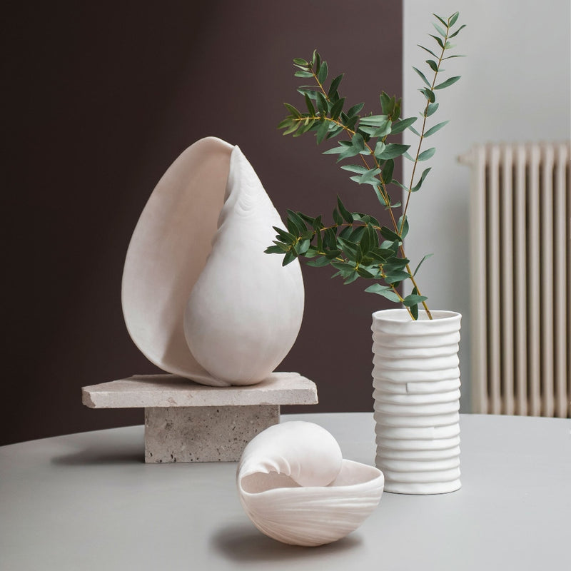 Small and Large off-white faux conch shell styled with vase