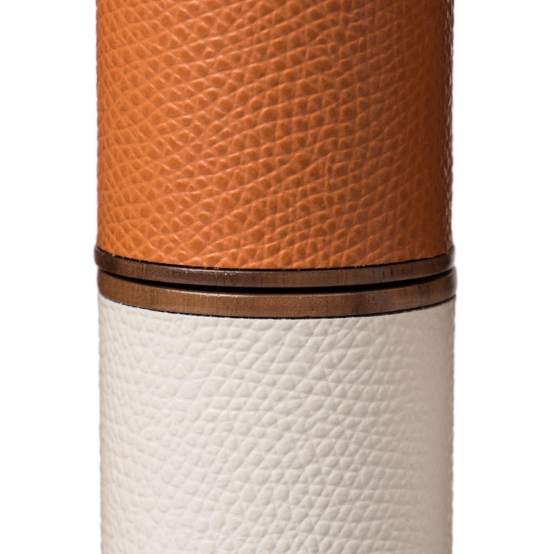 Detail of the Luxury Connect Four game set in mango and white grained leather with satin brass bars by Pinetti