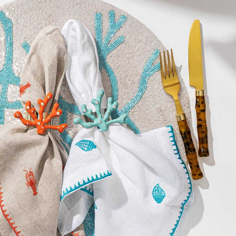 Decorative table setting with Coral-shaped place card holder in coral enamel with gold and crystal accents by Joanna Buchanan
